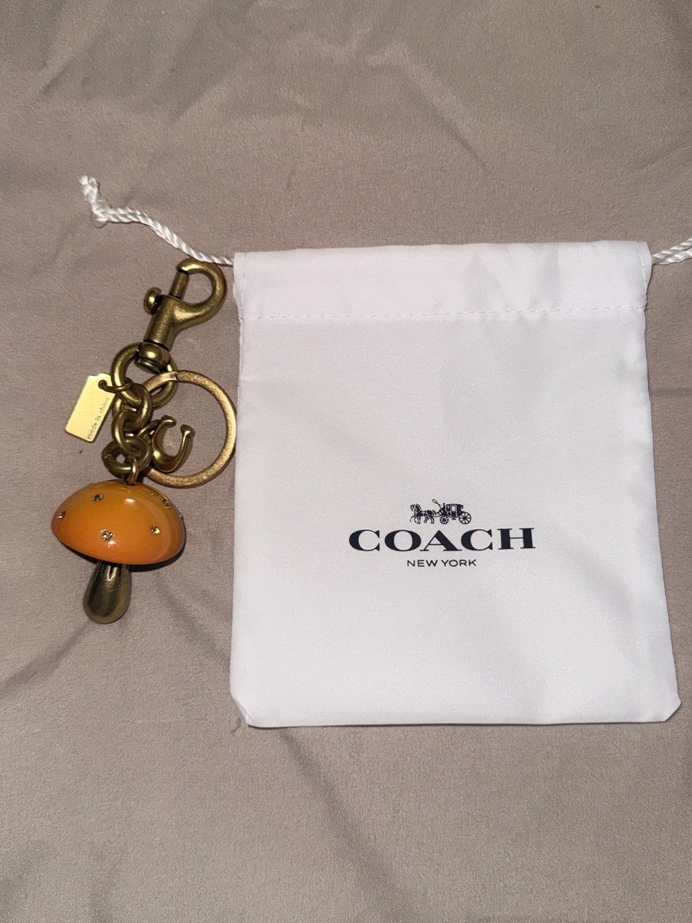 Coach Orange Enamel Mushroom Key Charm with Antique Gold Hardware